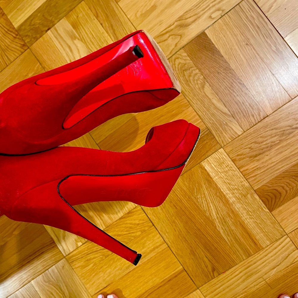 Christian Louboutin peak toe platform 
Signature red leather sole